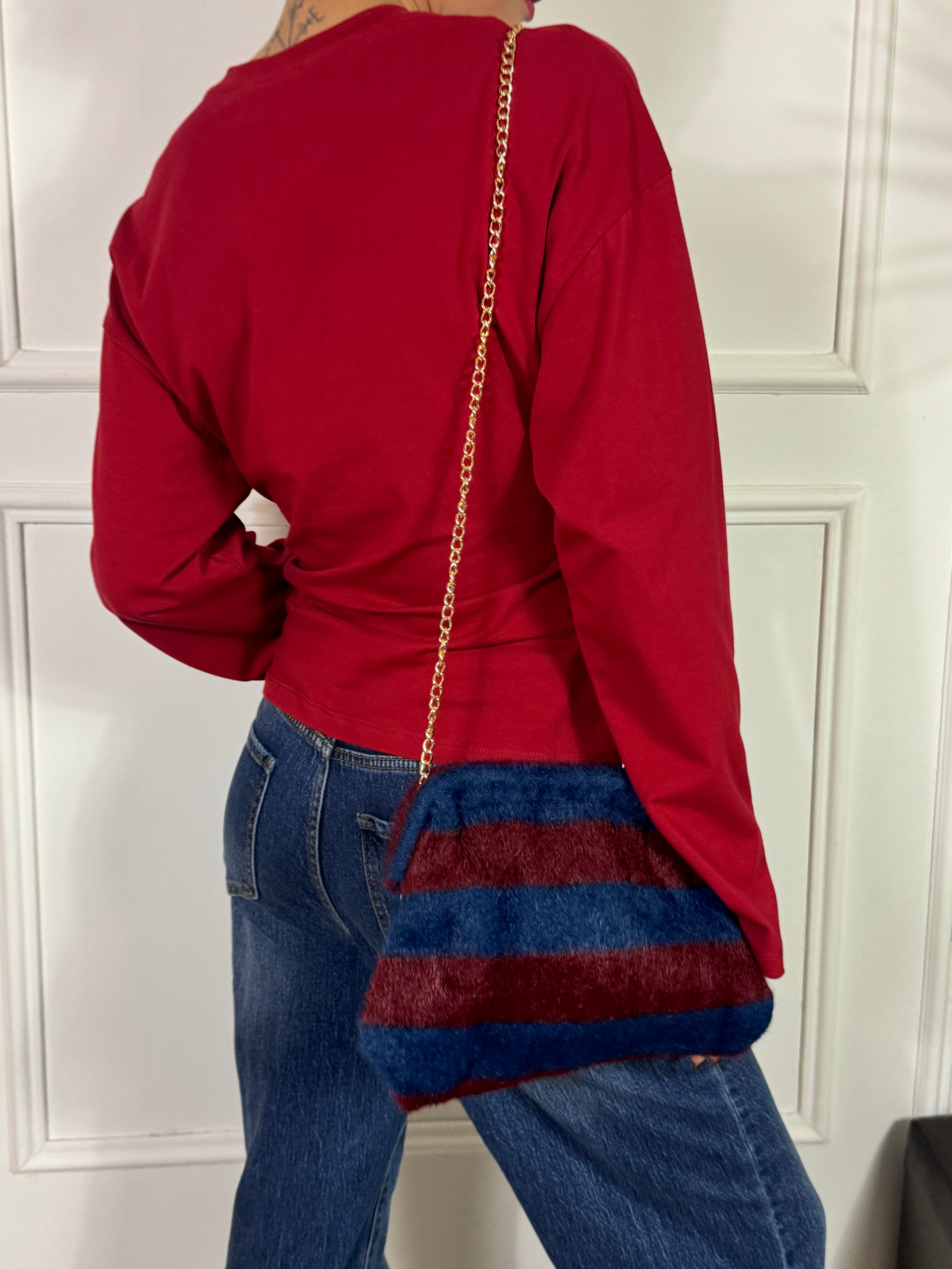 Borsa clutch pelosina a righe