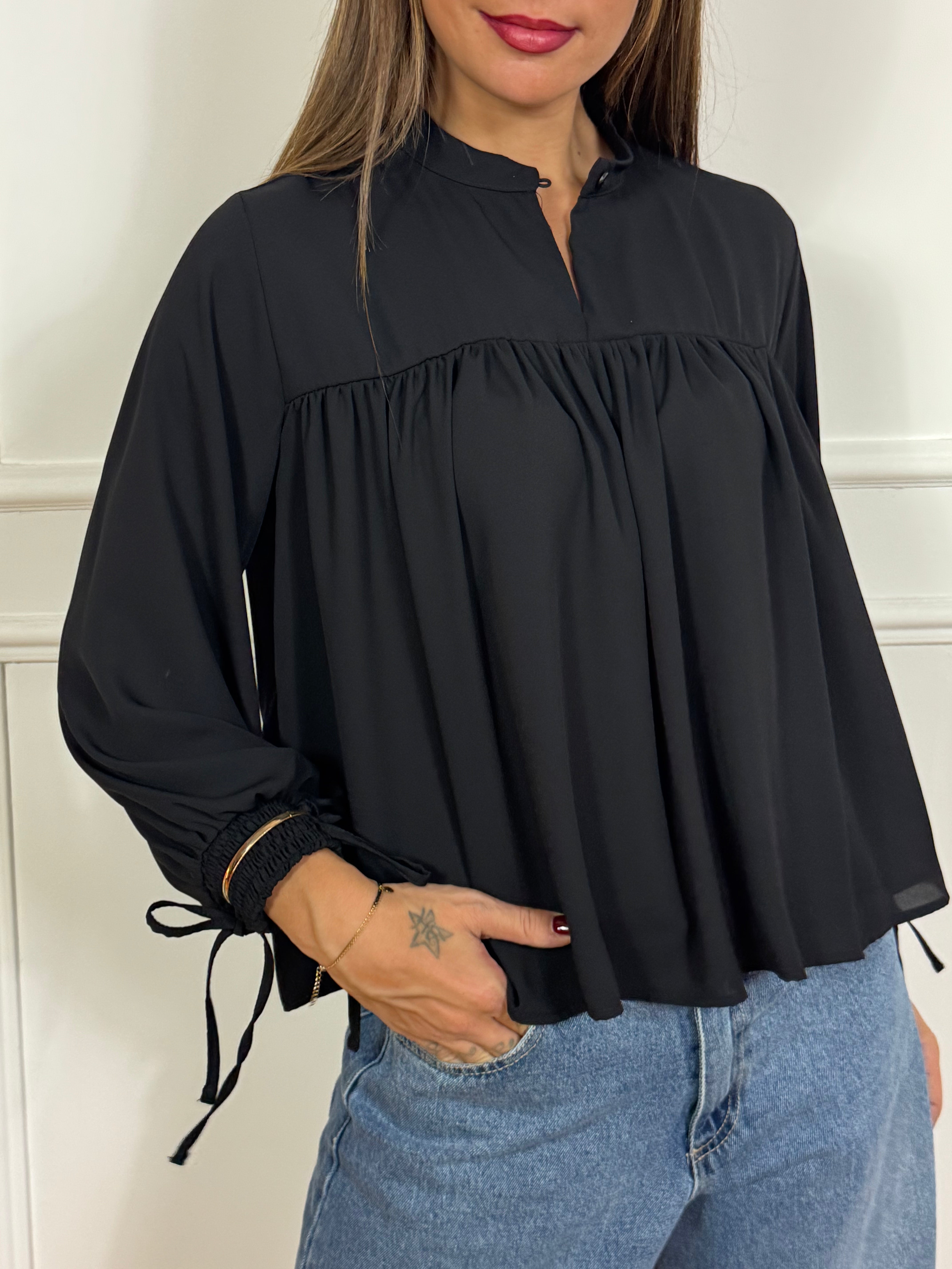 Blusa Kikisix con bracciali