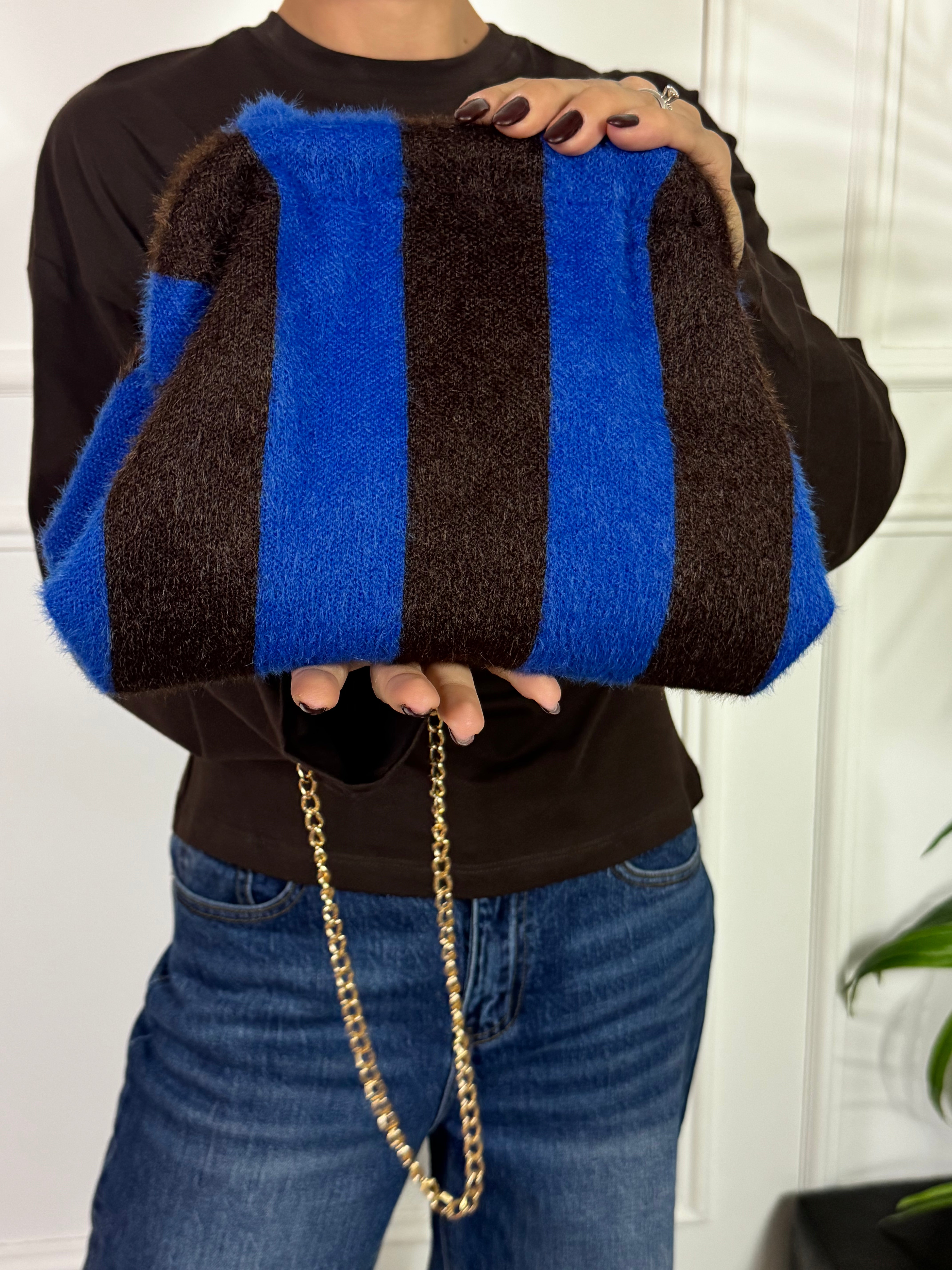 Borsa clutch pelosina a righe
