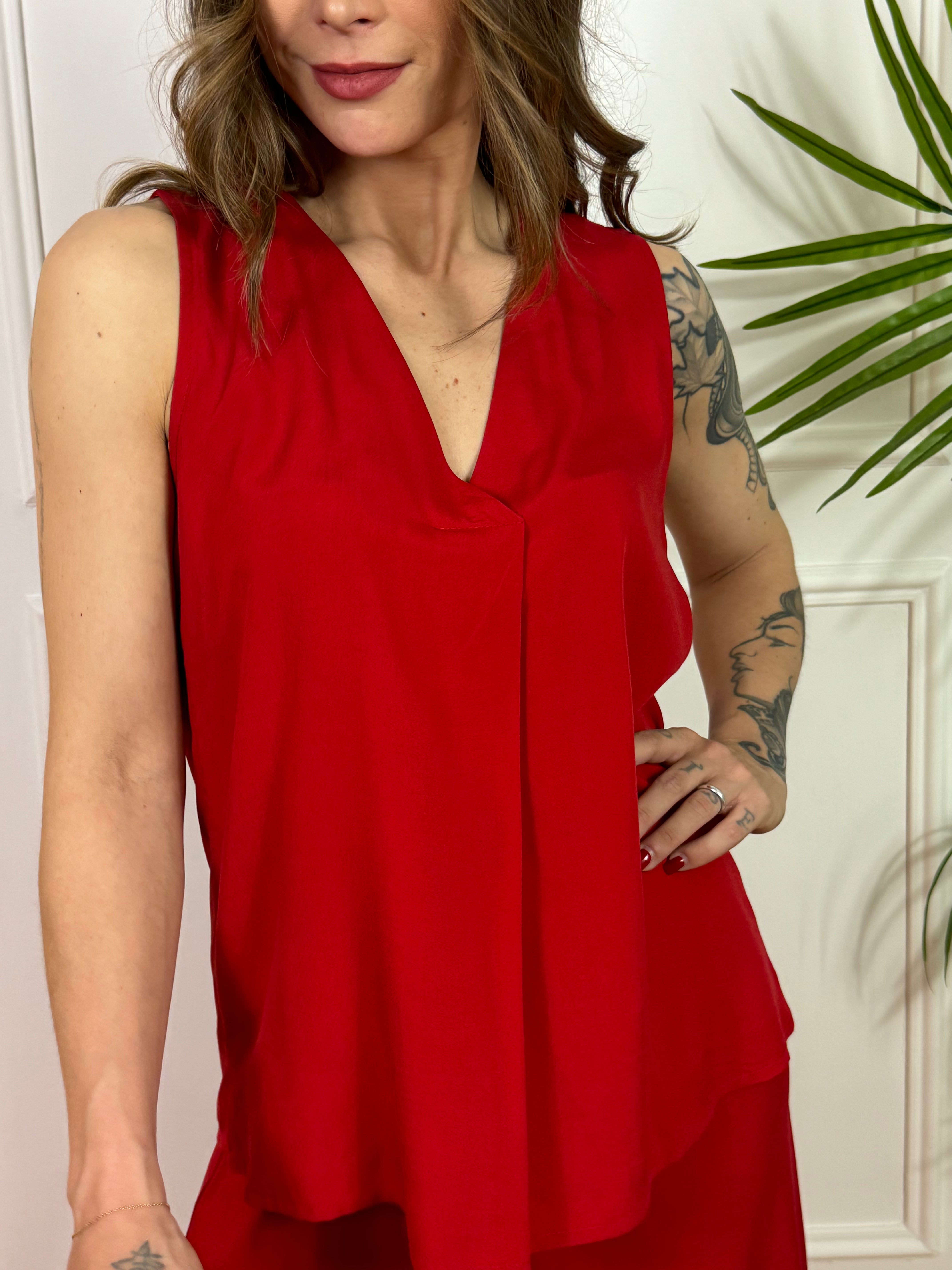 Top Kikisix scollo V tinta unita